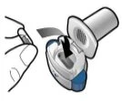 A hand pressing a finger onto a black button of a white and blue medical device to activate the injection mechanism