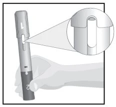 Technical drawing of a hand holding an injection pen with an enlargement showing a detailed view of the upper part of the device