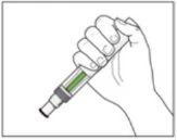 A hand firmly squeezing a cylindrical medical device with a central green section and a