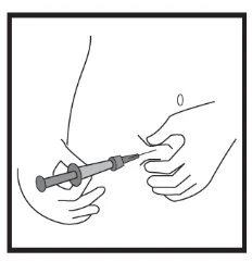 A hand holds a syringe and the tip of the