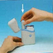 Two hands preparing a white medical inhaler with open lid and a white arrow pointing downward above the device
