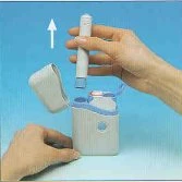 A hand lifting a white cylindrical medical device from a matching base on a light blue background with a white arrow pointing toward the