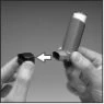 Two hands show how to fit the bottom of a cylindrical inhaler into the black cap indicated by a white arrow