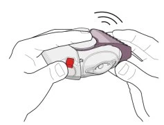 Due mani tengono un dispositivo medico bianco con un pulsante rosso e un indicatore di pressione superiore che emette un segnale sonoro