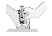 Two hands holding a syringe to inject the contents onto the top of a skin elevation or body area