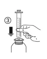 A hand holds a graduated syringe and pushes it downward to insert it