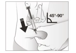 A hand holds a syringe for an