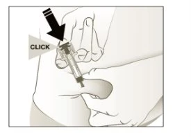 Hands holding a syringe ready for