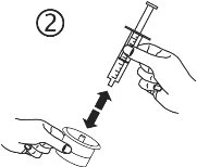 A hand holding a syringe and moving it toward the