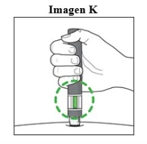A hand holding a cylindrical medical device with a green indicator surrounded by a dashed circle above a flat surface