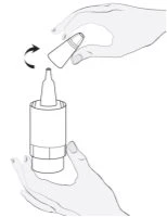 A hand rotates a capsule toward a cylindrical container held by another hand
