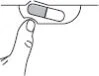 Line drawing of a hand pressing the thumb on a two-part capsule