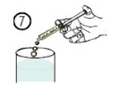 A hand holds a tilted syringe to let drops of liquid fall into a transparent container with the number 7 in a circle at the top left