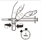 A hand rotating a vial connected to a syringe via a connector, with a