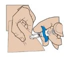 Two hands holding a syringe with a blue device to inject medication into the skin of the arm or thigh
