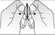 Two hands grasping the skin between thumb and index finger with black arrows indicating lateral pulling motion towards the