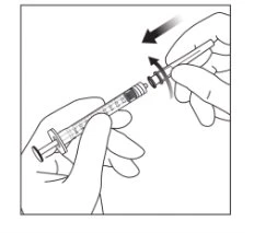 Two hands assembling a syringe by rotating the