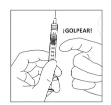 One hand holding a graduated syringe vertically while the
