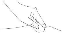 Black line drawing of a hand holding and pressing a small round object against a curved surface or body part