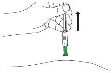 A hand holding a syringe with a