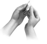 Two hands holding and carefully breaking open a small narrow vial or medical container gripped between the fingers