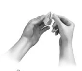 Two hands gently holding and separating a small white pouch or envelope against a neutral background