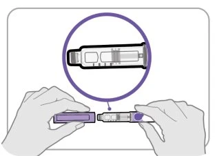 Two hands holding and joining two parts of a medical device for