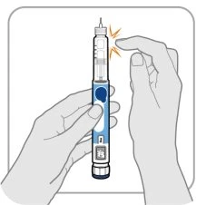 A hand holding a blue and white injection pen while preparing for administration
