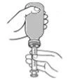 A hand holds the top part of a medical device while the