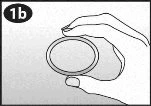 A hand holds between the thumb and