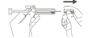 Two hands preparing a syringe, one holding the body of the device and the other