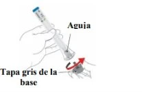 A hand holding a syringe with the