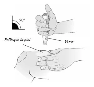 A hand holding a vertical medical device with a viewing window while the injection process is initiated