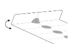 Diagramma schematico che mostra una superficie con quattro macchie grigie disposte in linea diagonale e una freccia curva a sinistra