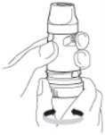A hand holding a cylindrical medical device while the