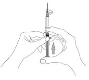 Two hands holding a syringe with the needle pointing upward