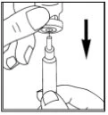 A hand holds a medical device while the