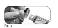 A hand removing the protective cap from a needle to attach it to a transparent syringe with milliliter graduations
