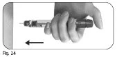 A hand holding an injection pen horizontally with a black arrow indicating the direction of movement to the left