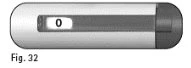 Pen-shaped medical device with a numerical indicator showing zero on a light background and a dark end cap