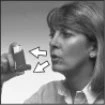 Woman holding an inhaler close to her mouth with two white arrows indicating the movement of medication toward the open mouth