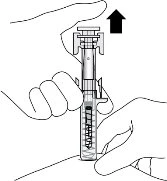 A hand holding a pre-filled syringe while another hand removes the needle cap