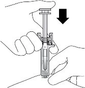 A hand holding a syringe while another hand adjusts the injection site