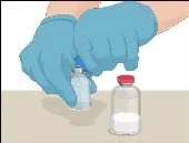 Two hands with blue gloves handling a transparent glass vial next to another vial with a red cap and white liquid