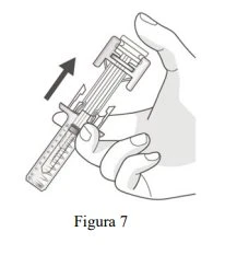 A hand holding a syringe with a