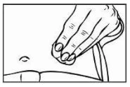 A hand pinches the skin of the