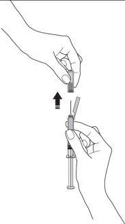A hand inserting a protective cap over the