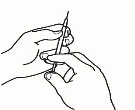 Two hands holding a syringe with needle pointing upward