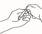 Two hands holding a syringe with needle to prepare or administer a drug through a pressing or manipulation movement