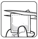 A hand holding a small square sheet while tweezers grasp its edge